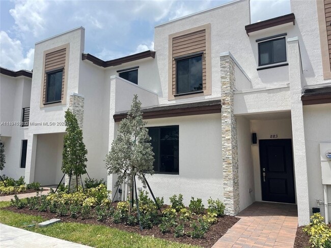 property at 883 NE 211th St