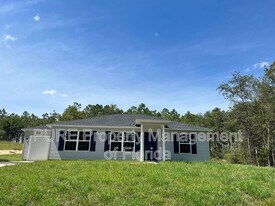 254 Malauka Loop in Ocklawaha, FL - Building Photo