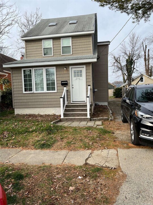 296 Doherty Ave-Unit -1 in Elmont, NY - Building Photo