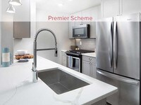 Premier Scheme Kitchen with Whirlpool Stainless Steel Appliances - Avalon at Newton Highlands Apartments in Boston, Massachusetts