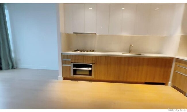 property at 136-18 Maple Ave