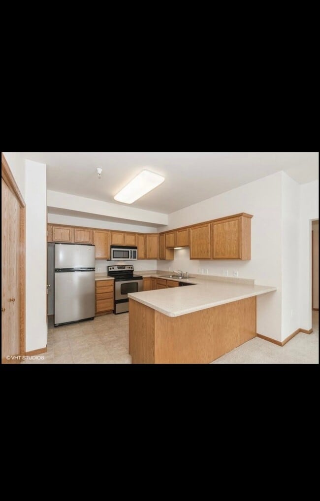 90 Jefferson St, Unit #5 in North Liberty, IA - Foto de edificio - Building Photo
