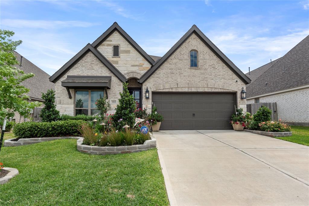 1112 Wandering Brook St in Magnolia, TX - Building Photo