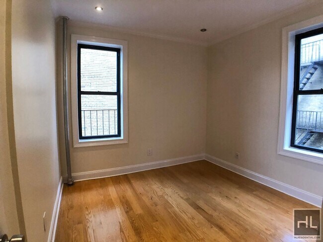 207-209-209 W 11th St