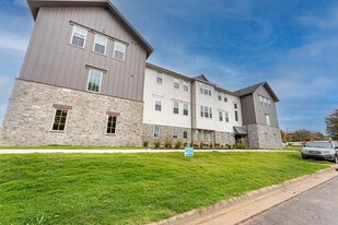 Pure Lowell Apartments in Lowell, AR - Building Photo