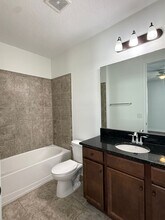 2-bedroom, 2.5-bath townhome located in Ea in Orlando, FL - Building Photo - Building Photo