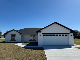 2711 SE 77th Ave in Bushnell, FL - Building Photo