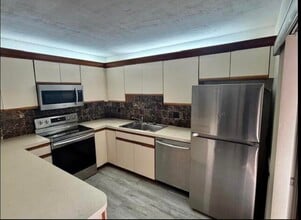 4628 Suburban Pines Dr in Greenacres, FL - Building Photo - Building Photo