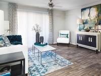Select homes feature wood-look flooring in the living spaces - Array South Mountain Apartments in Phoenix, Arizona