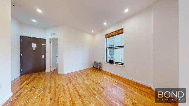 property at 68 E 1st St