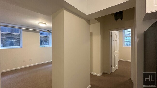 207-209-209 W 11th St