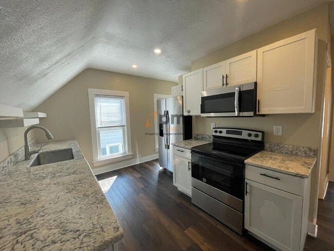 property at 1204 Manhattan St