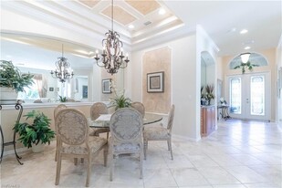 5725 Lago Villaggio Way, Unit 2107 in Naples, FL - Foto de edificio - Building Photo