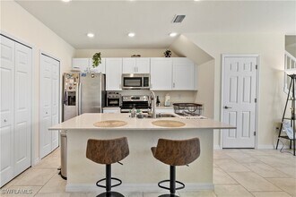 14026 Oviedo Pl in Tice, FL - Building Photo - Building Photo