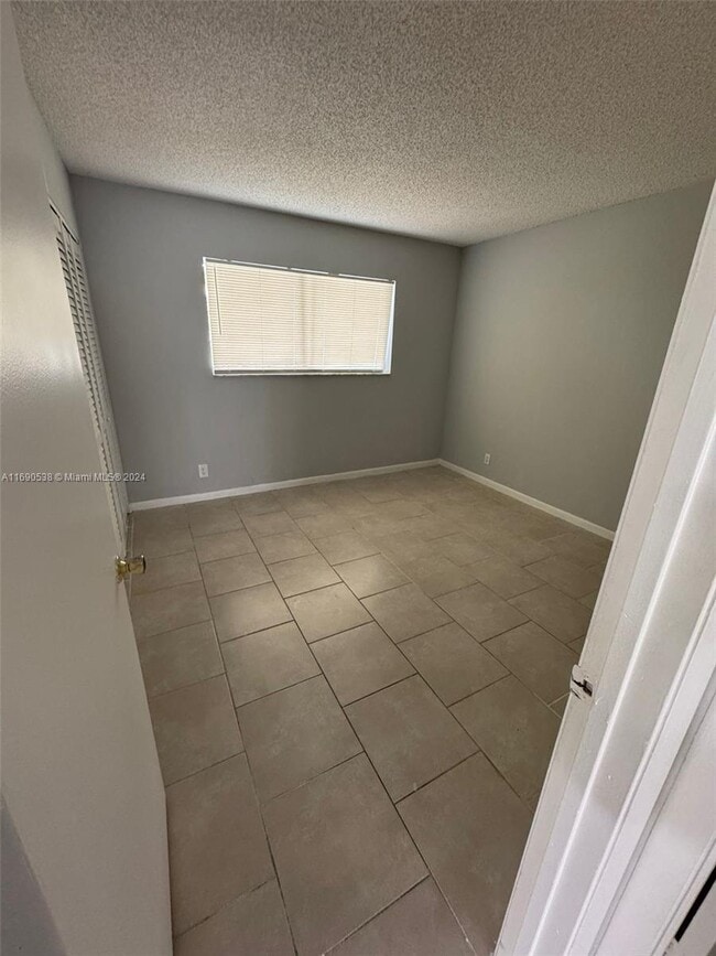 8560 N Sherman Cir, Unit 403 in Miramar, FL - Building Photo - Building Photo