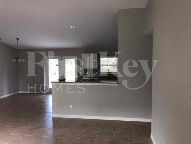 11986 Booth Ave in Port Charlotte, FL - Foto de edificio - Building Photo