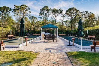 1511 Whispering Oaks Cir in Naples, FL - Building Photo - Building Photo