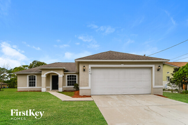 207 Harry Ave N in Lehigh Acres, FL - Building Photo - Building Photo