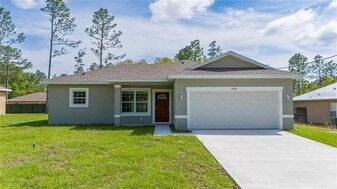 9301 N Akola Way in Citrus Springs, FL - Building Photo