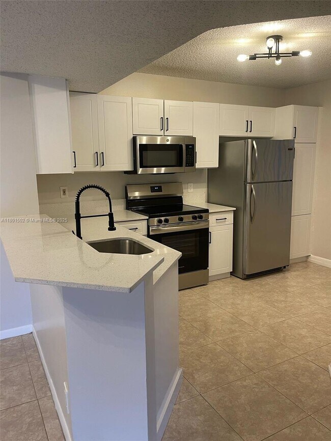 8781 Wiles Rd in Coral Springs, FL - Building Photo - Building Photo
