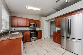 1125 Winding Water Way in Clermont, FL - Foto de edificio - Building Photo