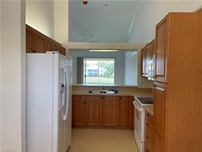 450 Robin Hood Cir-Unit -201 in Naples, FL - Building Photo - Building Photo