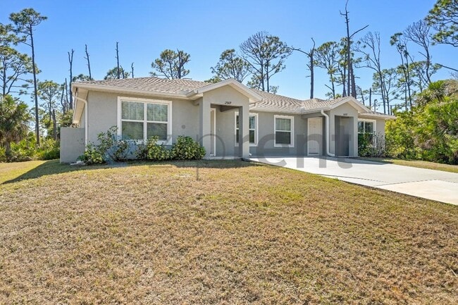 12009 Henley Ave in Port Charlotte, FL - Building Photo - Building Photo