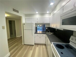 2400 E Commercial Blvd in Fort Lauderdale, FL - Building Photo - Building Photo