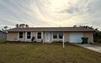 1057 Tropical Ave NW in Port Charlotte, FL - Building Photo