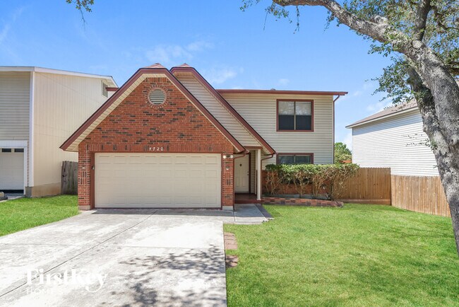 property at 7720 Wood Bluff