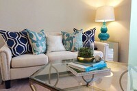 Spacious, open living rooms with plush carpeting. - Country Manor Apartments in Springfield, Massachusetts