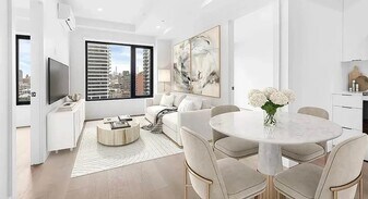 215 E 124th St in New York, NY - Building Photo