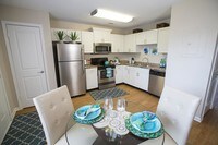 Gourmet style kitchen combines elegance and functionality with granite-style counter tops and stainless steel appliances. - The Legends at Lake Murray Apartments in Columbia, South Carolina