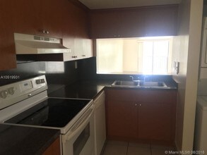9911 W Okeechobee Rd-Unit -1-208 in Hialeah, FL - Building Photo - Building Photo