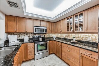 5633 Turtle Bay Dr in Naples, FL - Building Photo - Building Photo