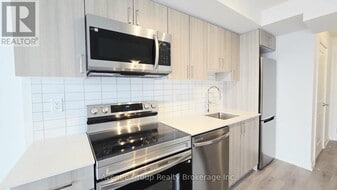 1010 Sandy Beach Rd in Pickering, ON - Building Photo