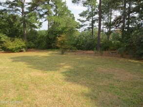 8 Country Club Blvd, Unit 504 in Whispering Pines, NC - Building Photo - Building Photo