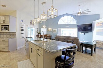 1579 Whispering Oaks Cir in Naples, FL - Building Photo - Building Photo