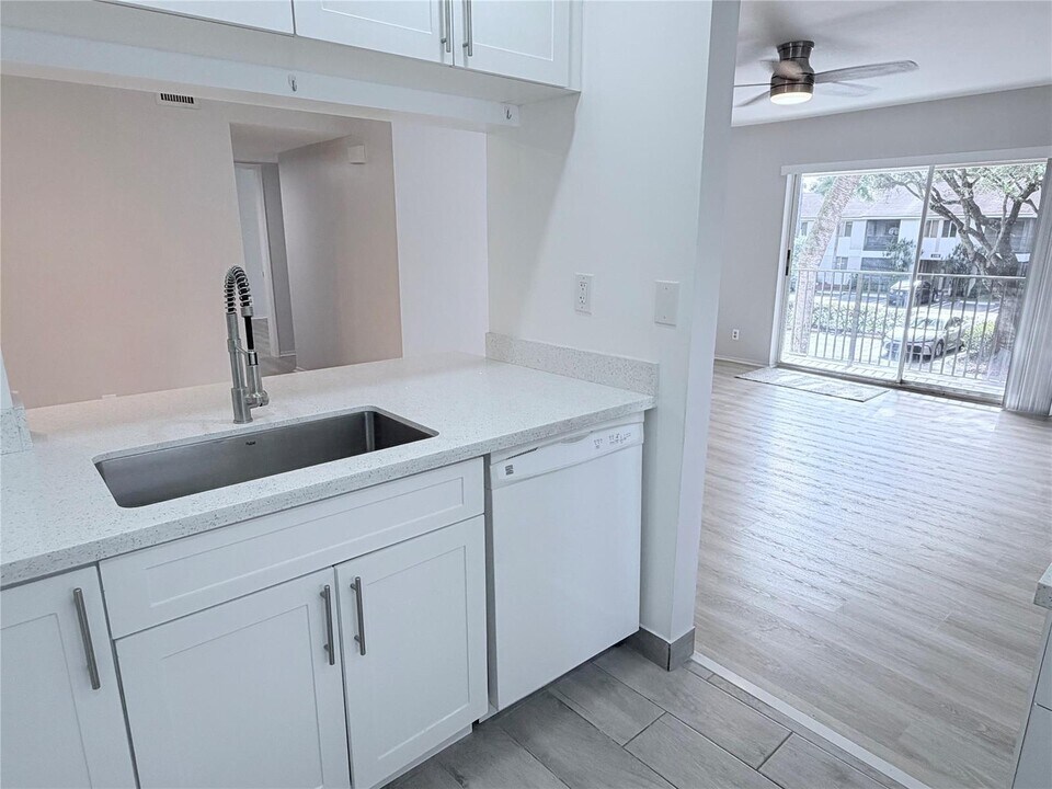 117 Gardens Dr, Unit 201 in Pompano Beach, FL - Building Photo