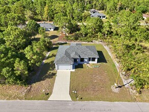 825 Carbon St E in Lehigh Acres, FL - Building Photo - Building Photo