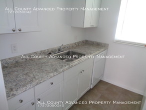 1428 Spring Ln-Unit -4 in Clearwater, FL - Foto de edificio - Building Photo
