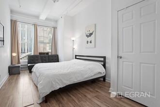 208 W 30th St-Unit -RM-401 in New York, NY - Building Photo - Building Photo