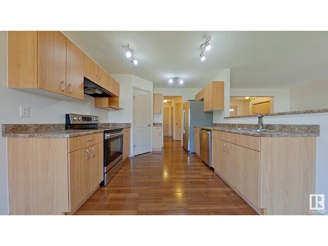 property at 11712-11713 13 Ave SW