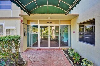 4990 E Sabal Palm Blvd in Tamarac, FL - Building Photo - Building Photo