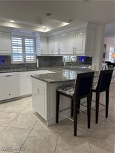 53 High Point Cir W in Naples, FL - Foto de edificio - Building Photo