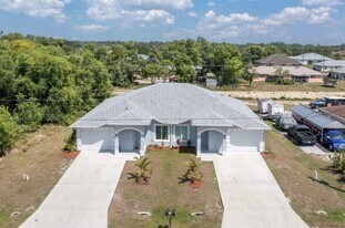 1109-1111 Hightower Ave S in Lehigh Acres, FL - Building Photo