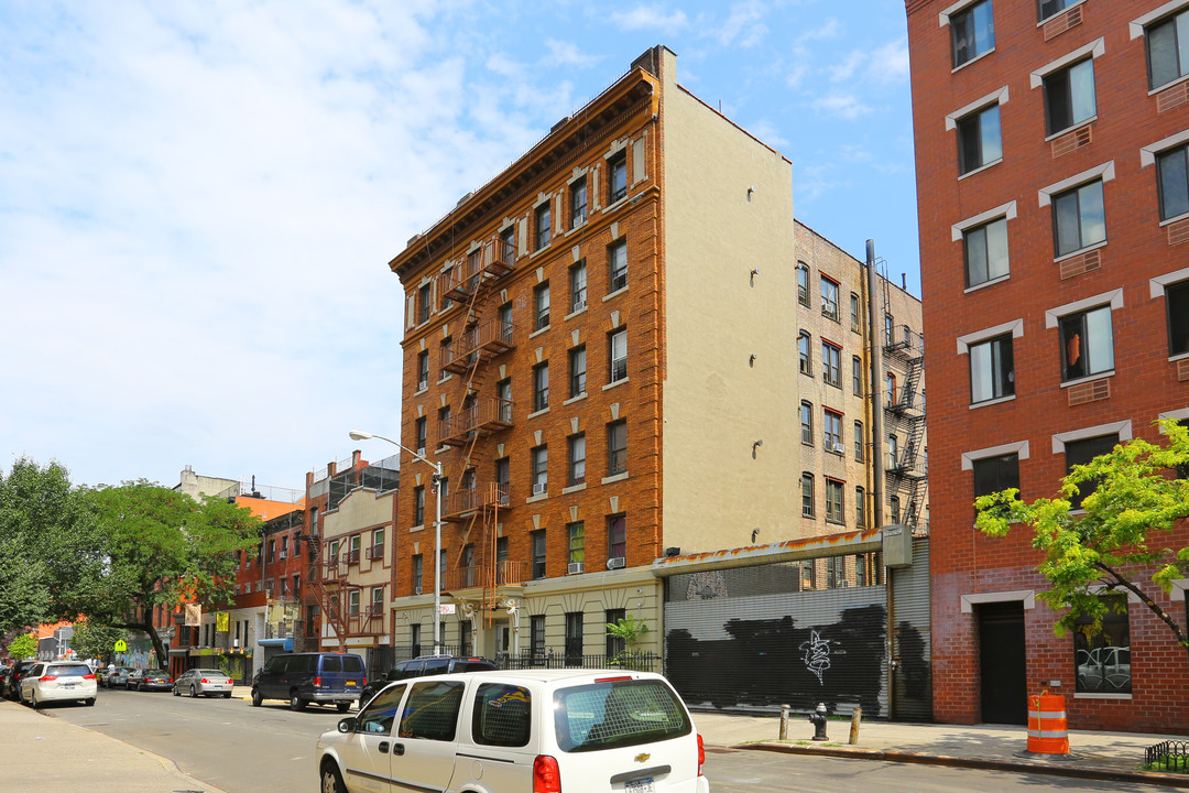 215-219 E 117th St in New York, NY - Building Photo