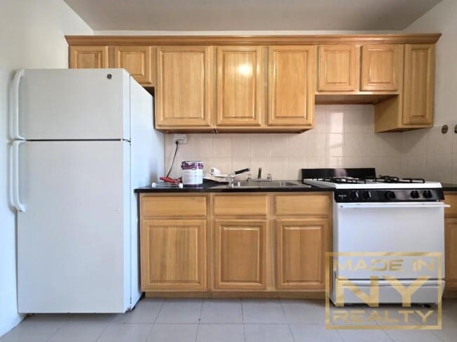 property at 65-10 108th St
