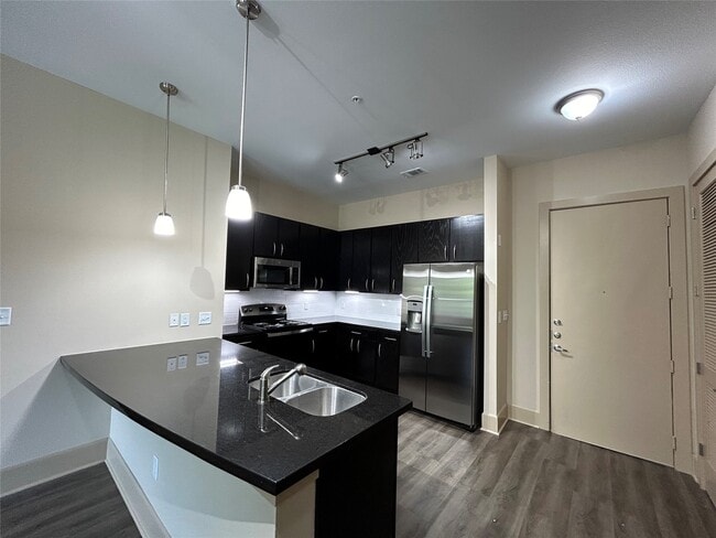 property at 230 T C Jester Blvd