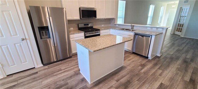 640 Pepperbark Loop in Mustang Ridge, TX - Building Photo - Building Photo